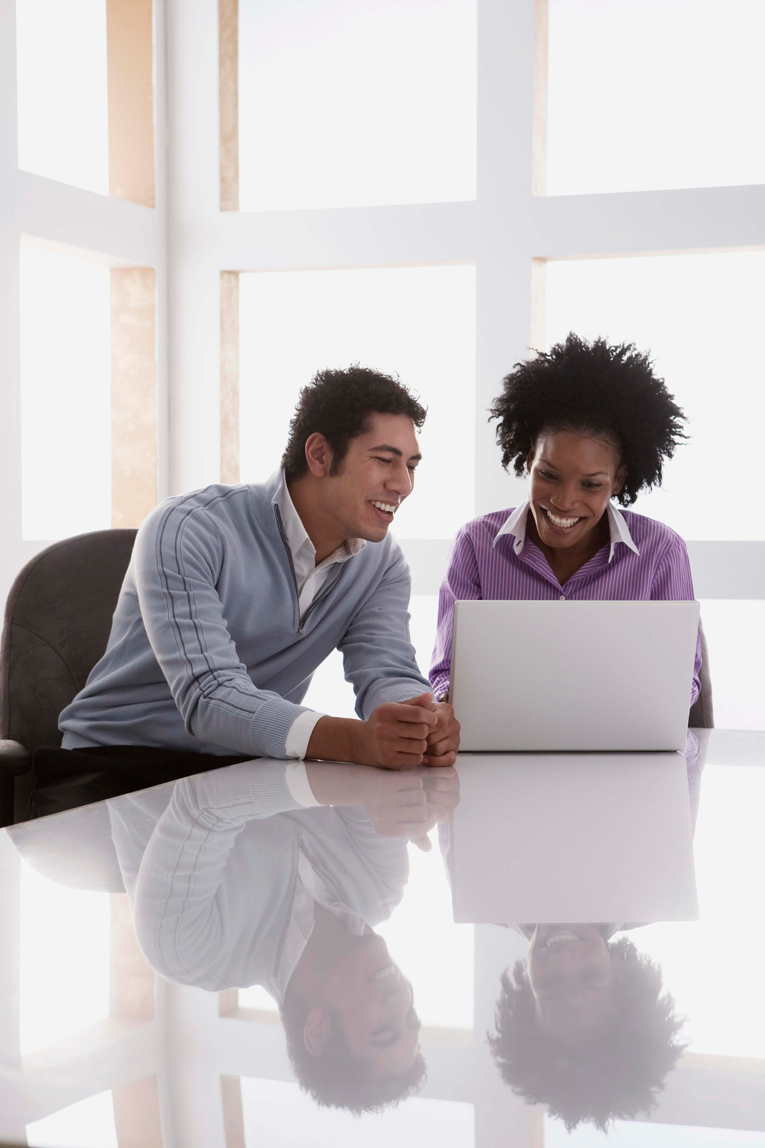 Businesspeople working on laptop